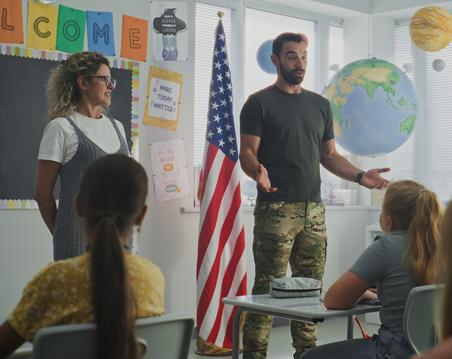 Students listening to classroom presentation
