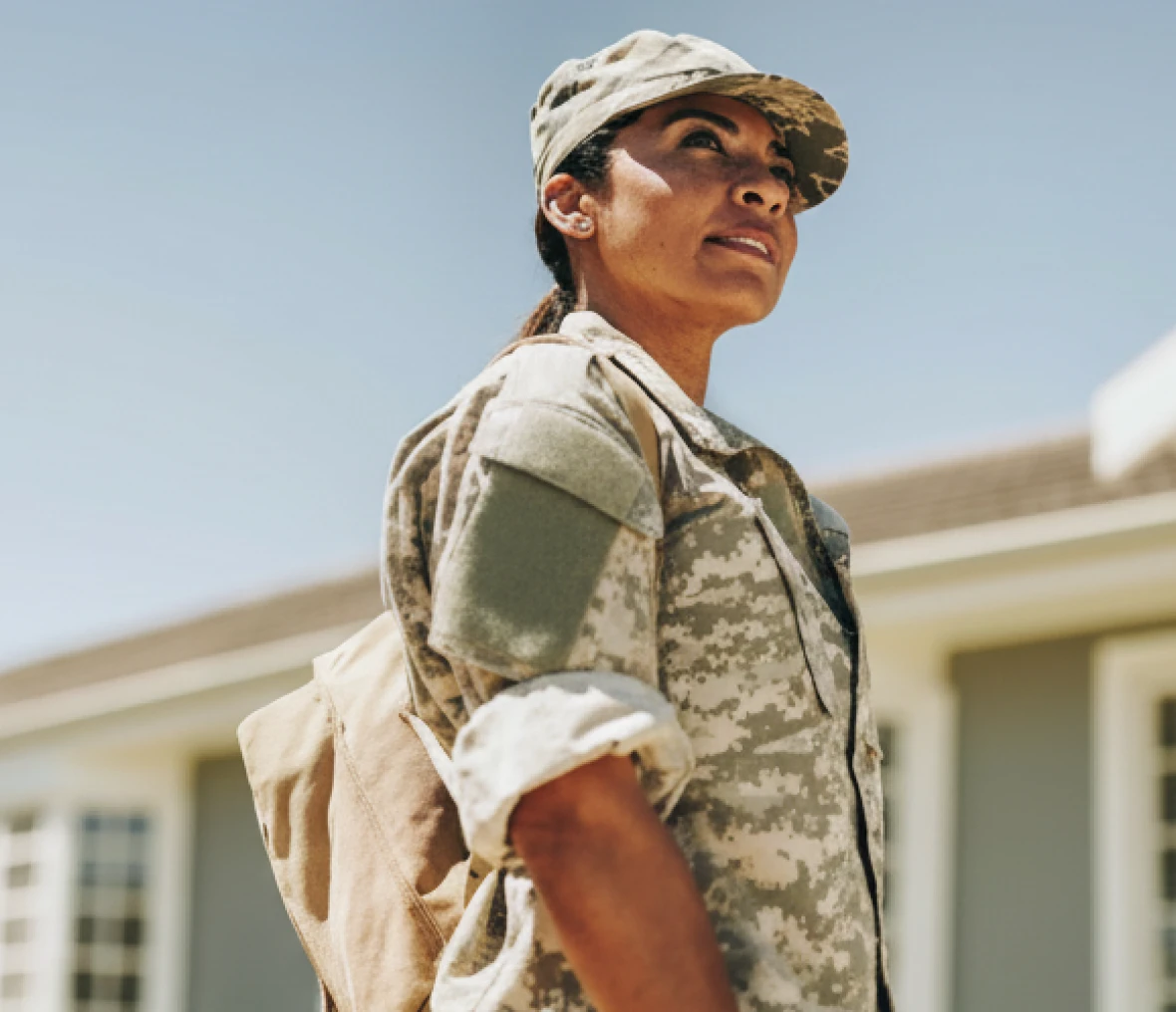 Soldier standing confidently in sunlight